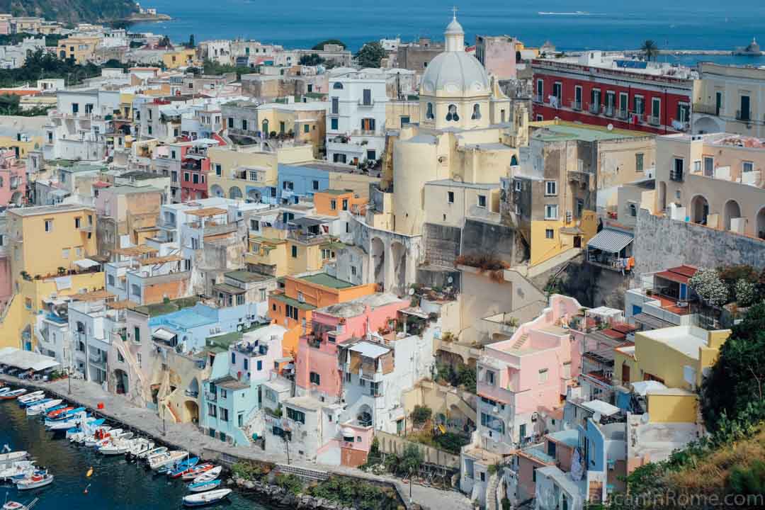 view of colorful houses in corricella procida a top place to stay on the island