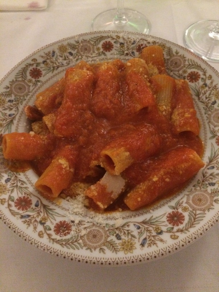 amatriciana pasta in Rome on a patterned plate that the restaurant Flavio al Velavevodetto is known for