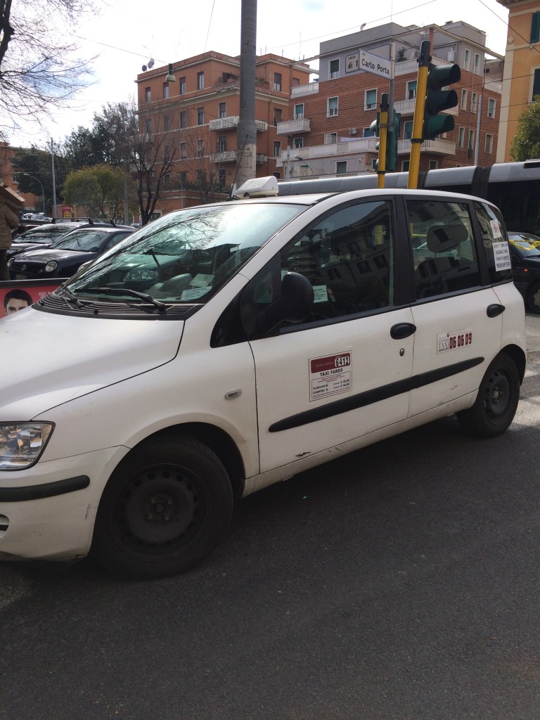 official Rome taxis are white and have the price from the airport written on the door