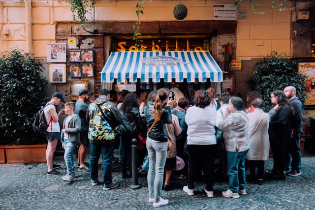 Line of people waiting to be let in to Sorbillo Naples for pizza