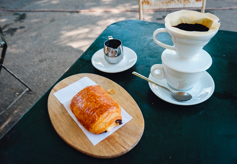 pour over coffee and chocolate croissant in Rome