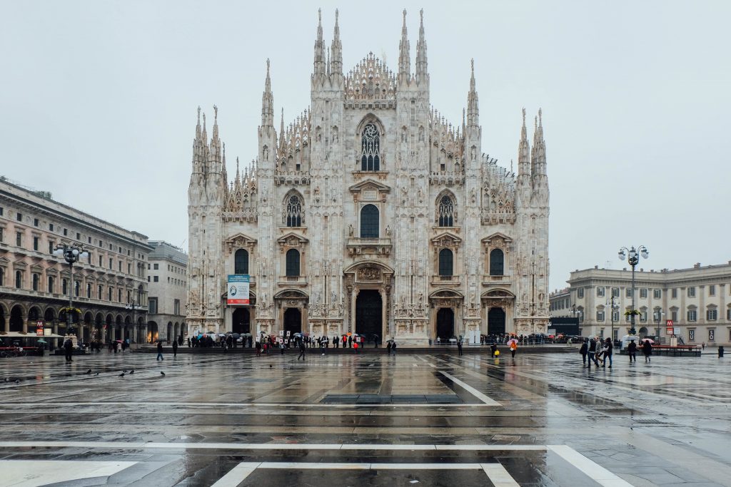 exterior of the milan duomo on a rainy day