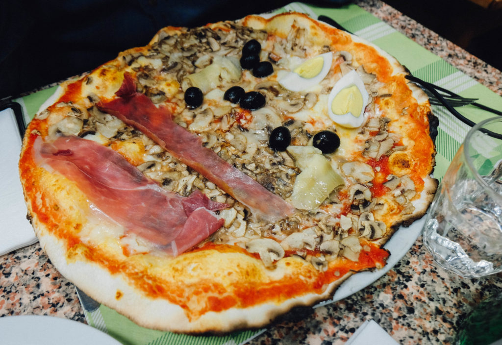 pizza with prosciutto and mushroom and egg