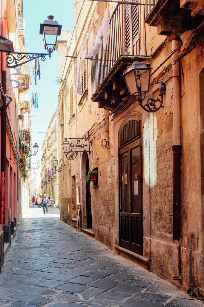 looking down a narrow street in Sicily