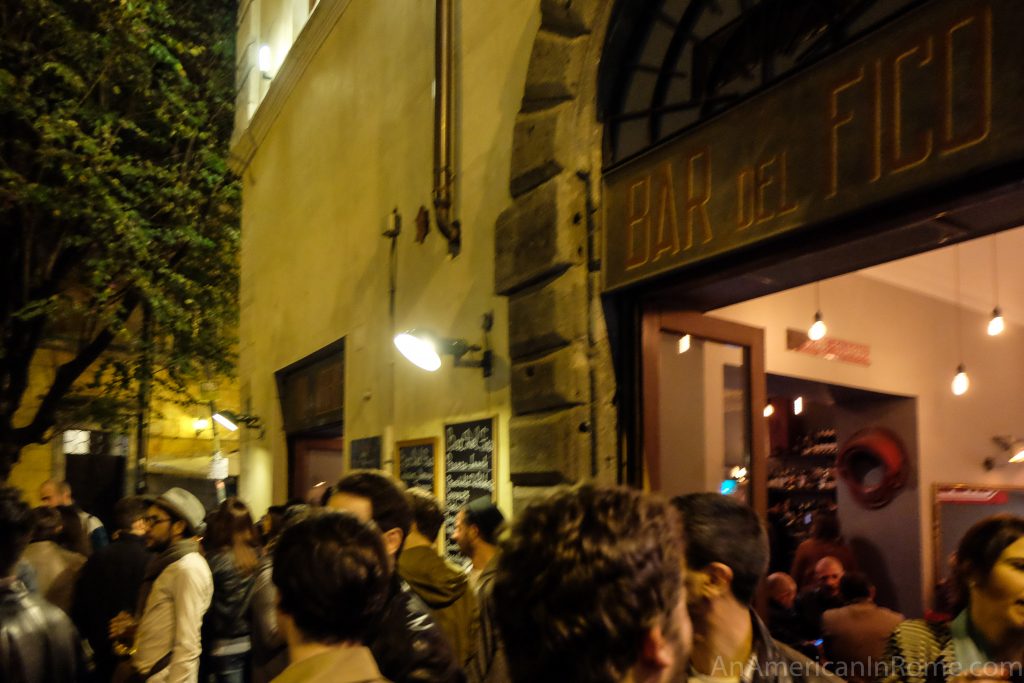 The top of the crowd outside of ever popular Bar del Fico in Rome