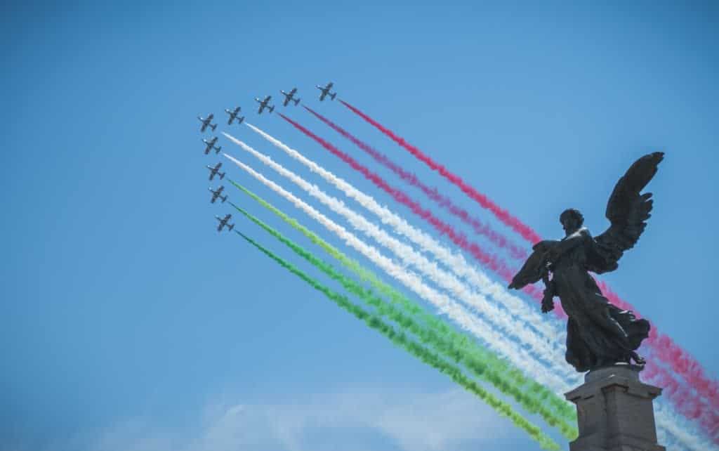 planes releasing trails in green white and red for Italy's Republic Day on 2 June