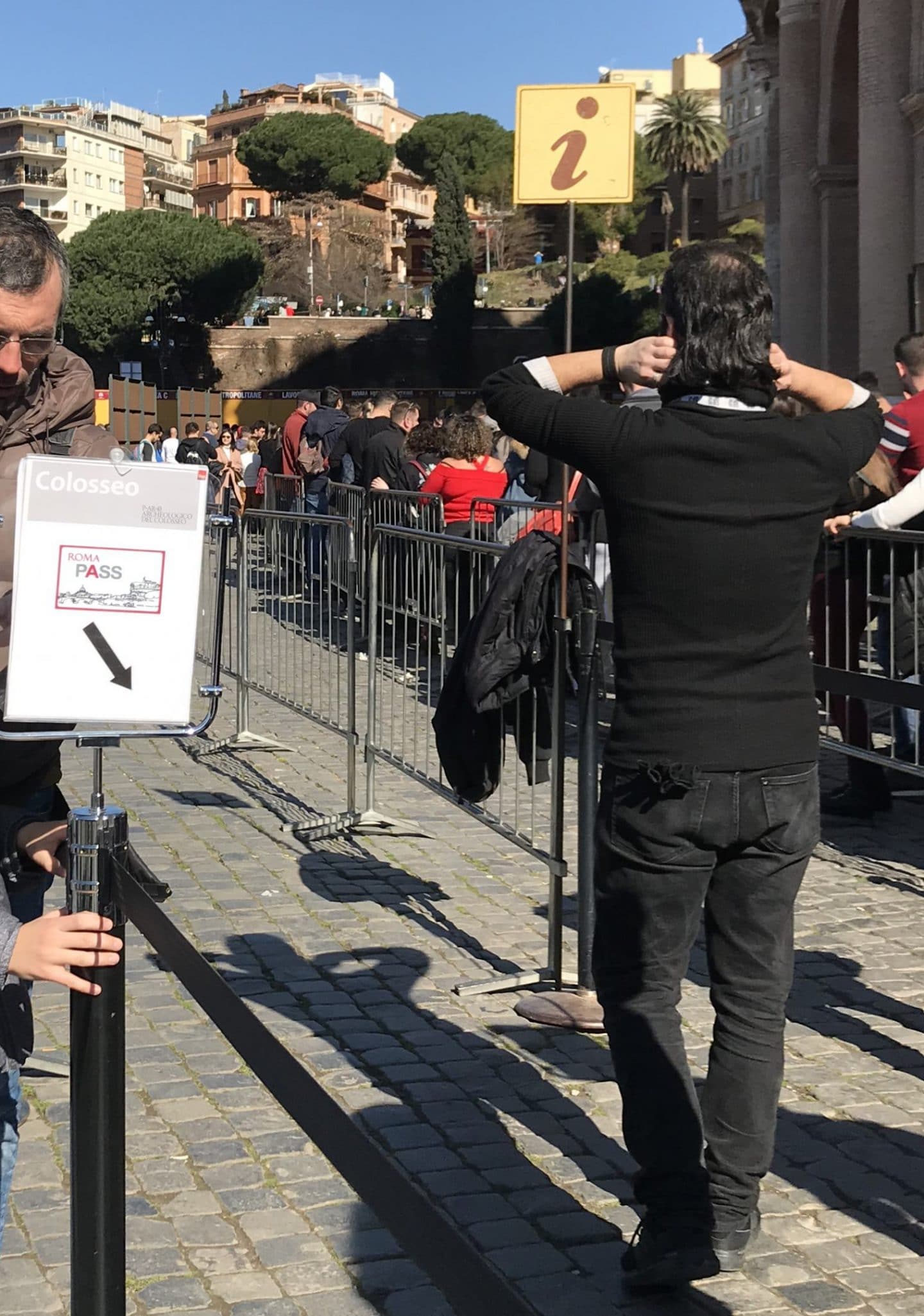 sign to enter roma pass line at colosseum