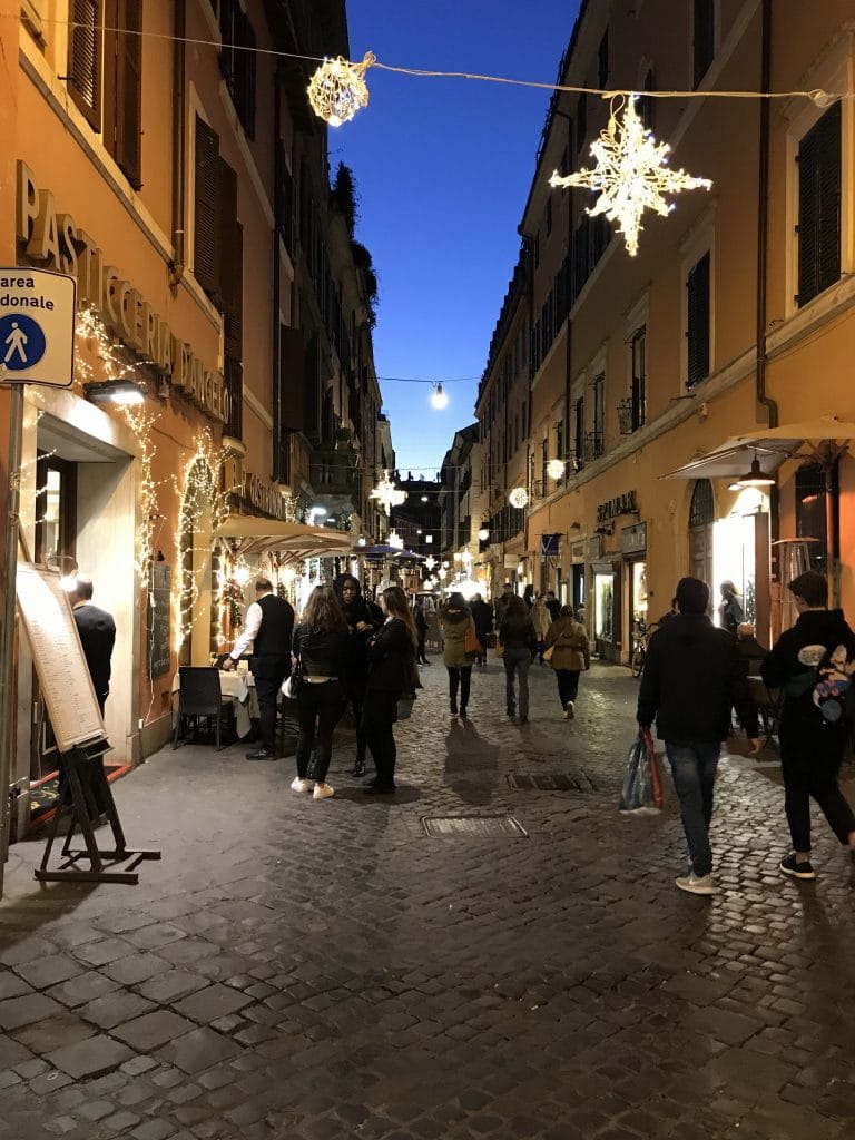 hanging lights for the holidays in Rome Italy