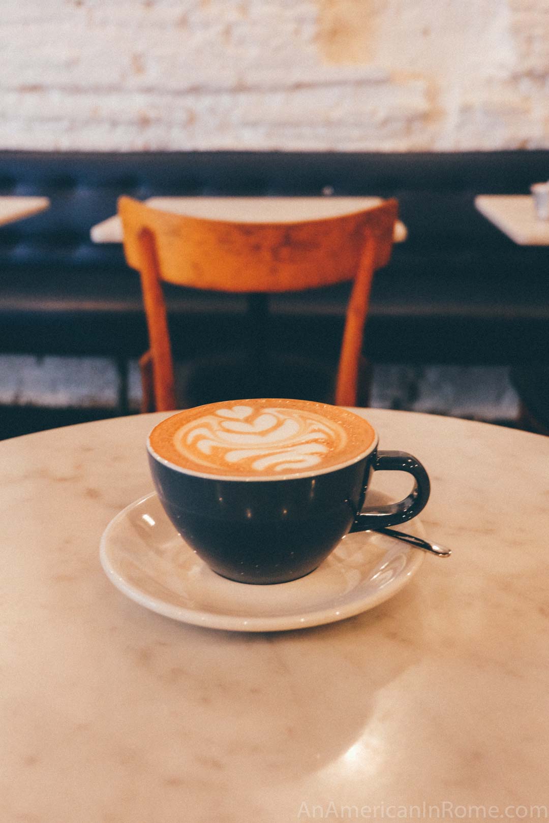 cappuccino in rome on a marble table at Barnum Cafe