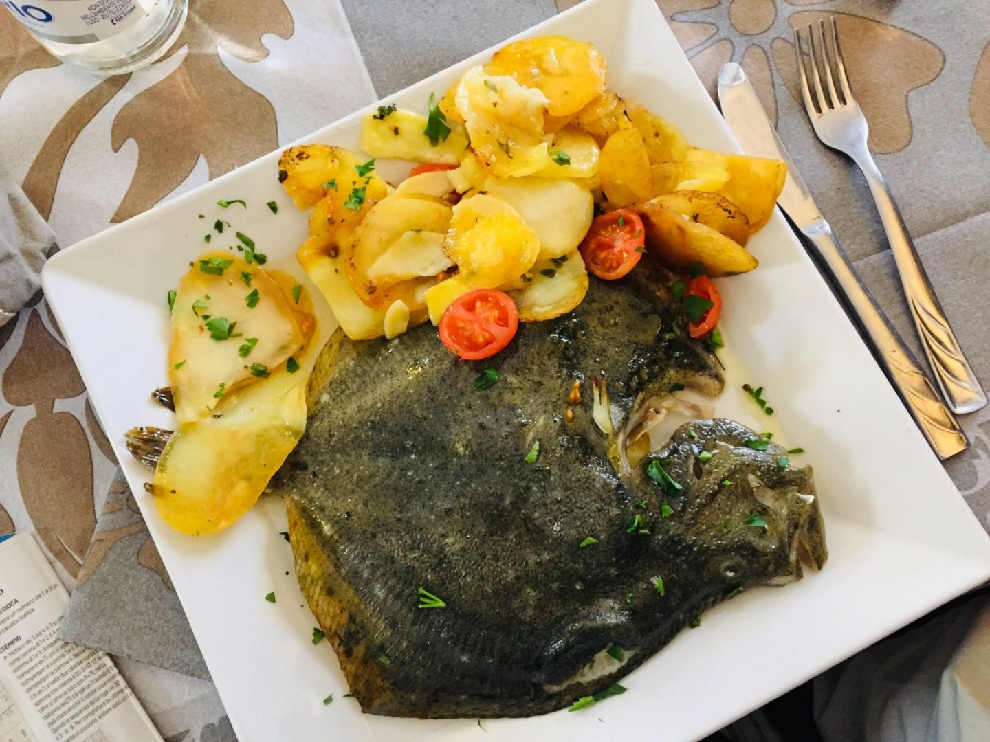 fish and potatoes on white plate