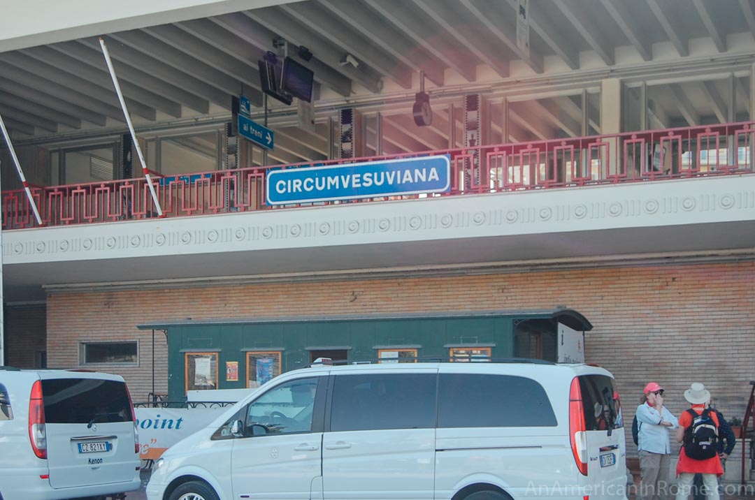 circumvesuviana station with cars parked in front