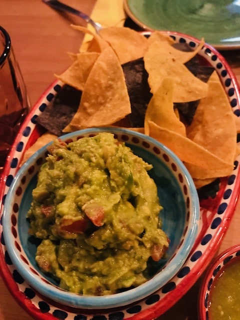 bowl of guacamole and chips on the side in Rome