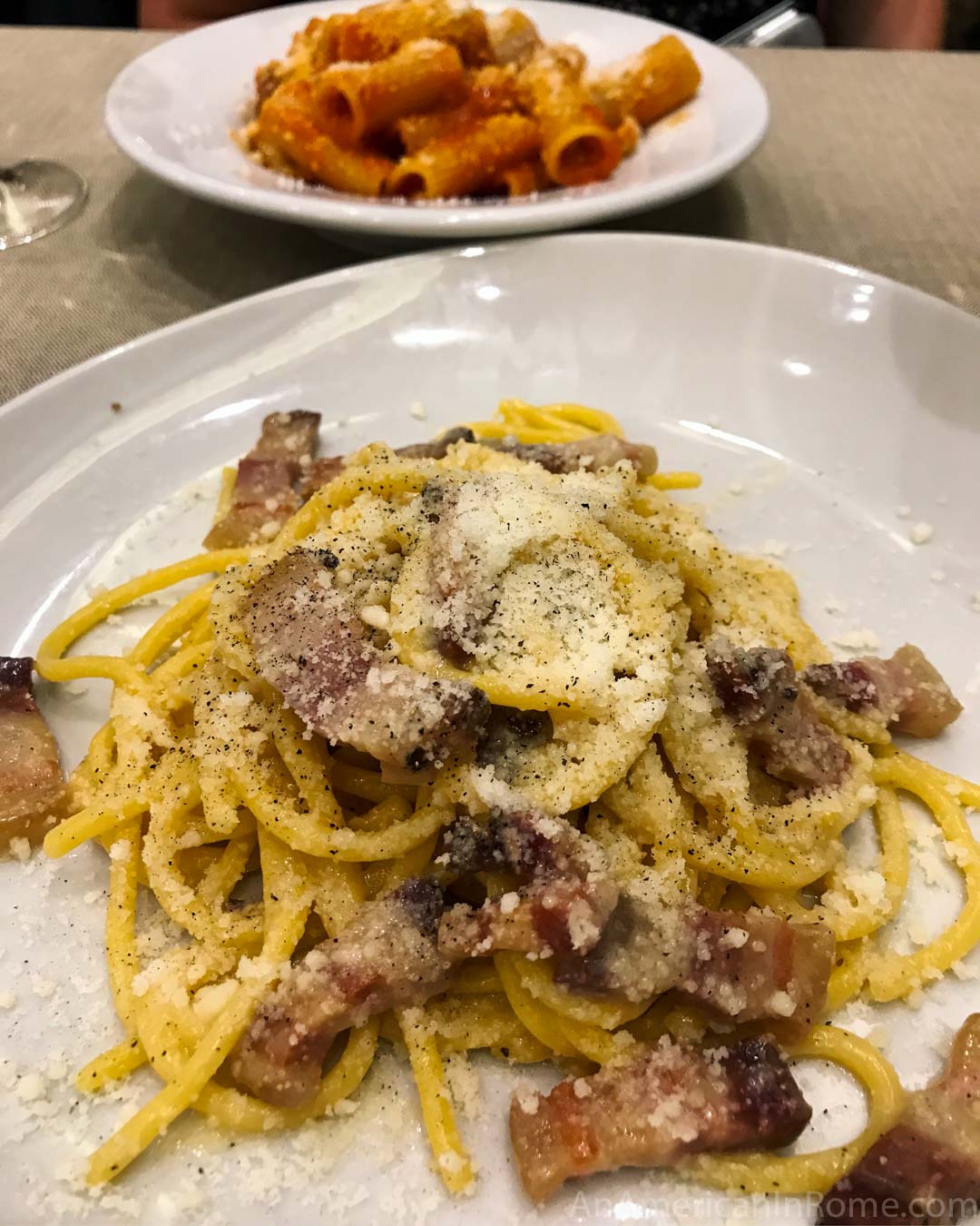 gricia pasta on white plate at La Tavernaccia