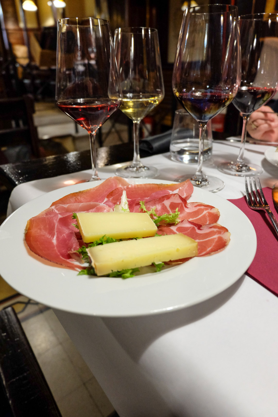 meat and cheese plate with wine tasting