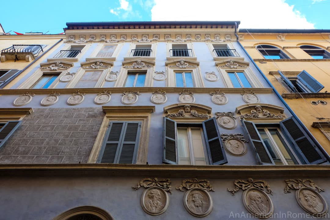 portraits on building in Rome