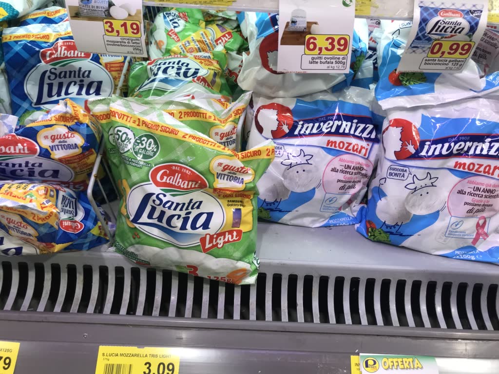 colorful bags of cheese in supermarket