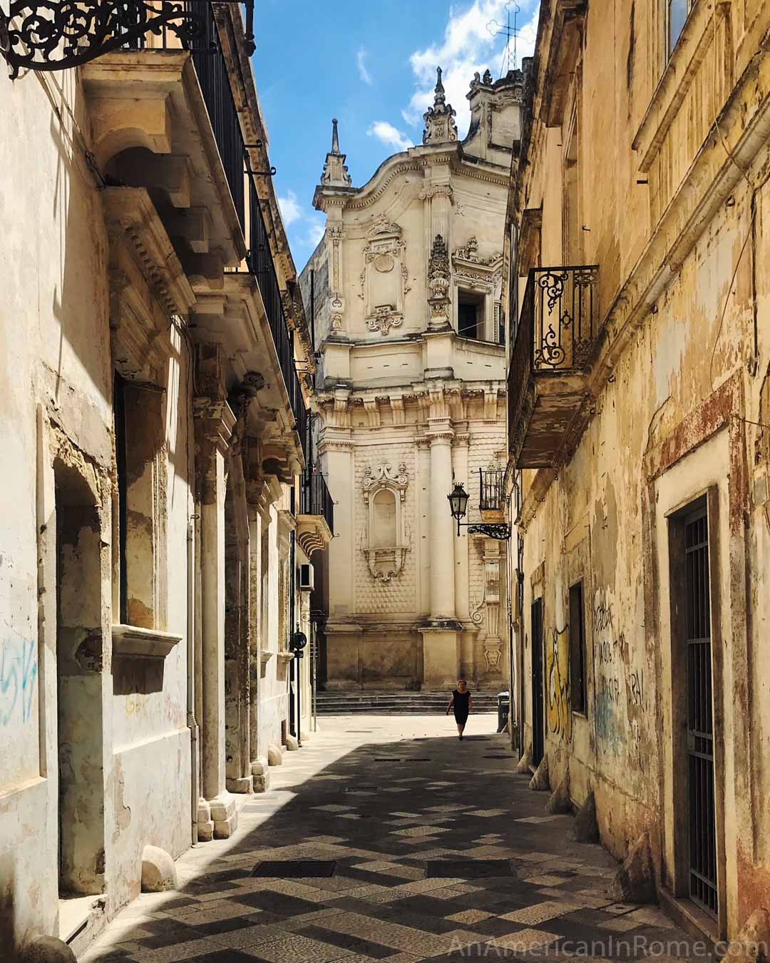 narrow street and church in Puglia