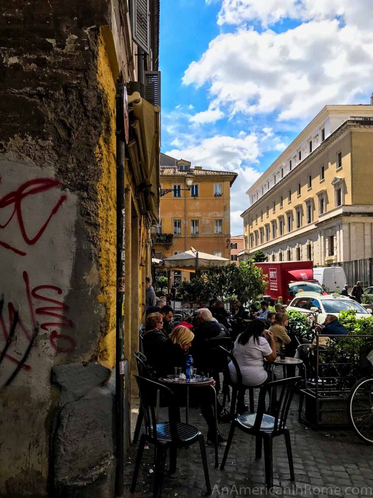 old walls and outdoor tables in rome