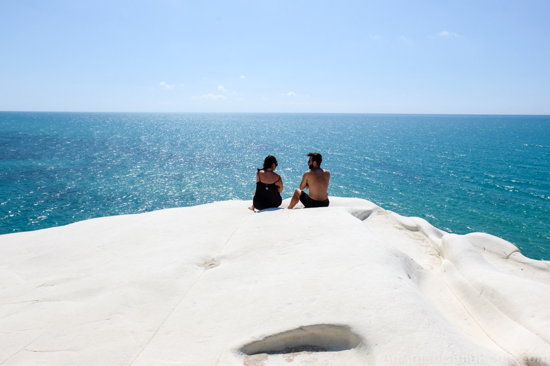 man and woman look at horizon at scala dei turchi